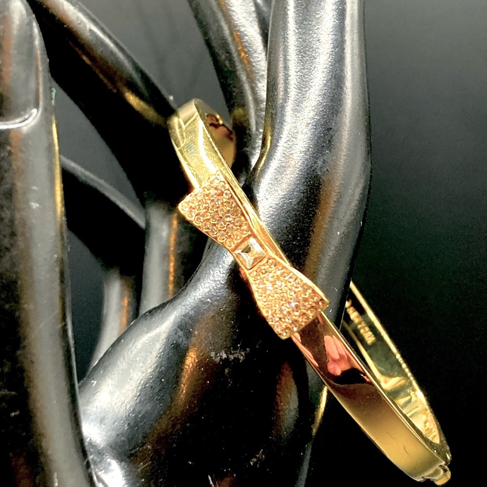 Kate Spade Gold Tone Bangle Bracelet With Rhinestone Bow Tie